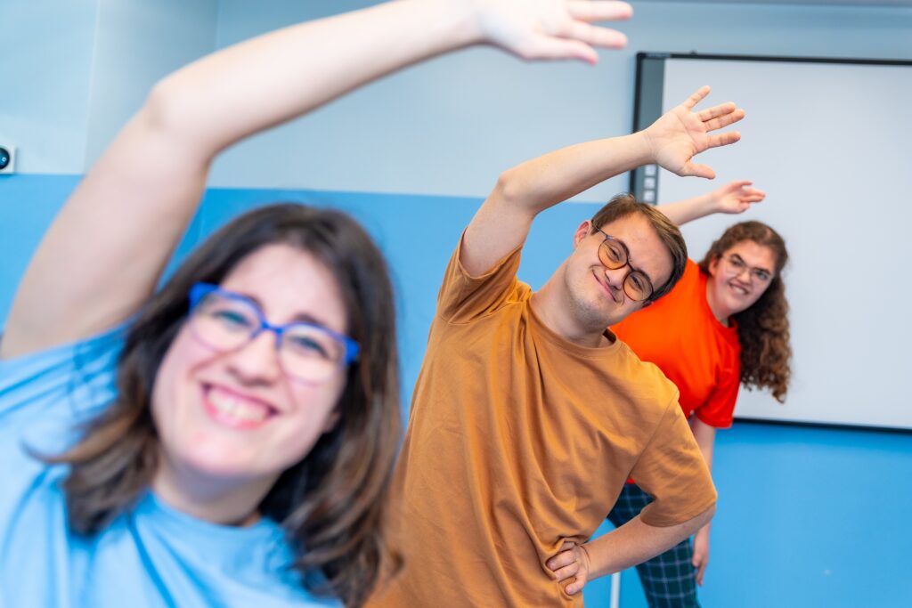 Young adults doing yoga moves