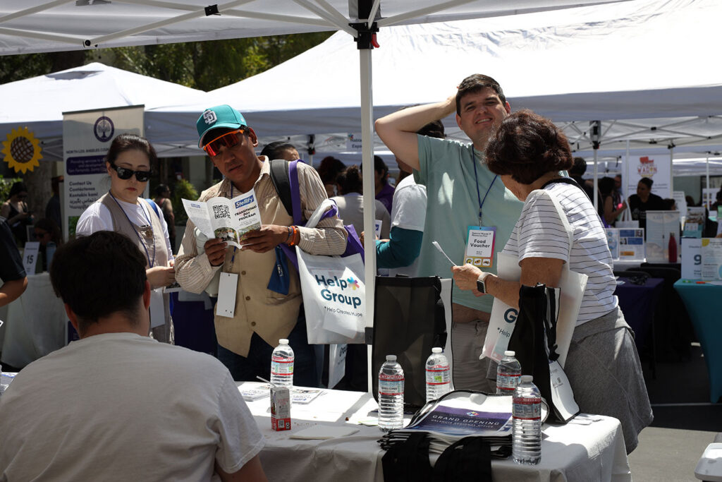 Attendees interacting with vendors at Resource Fair 2026