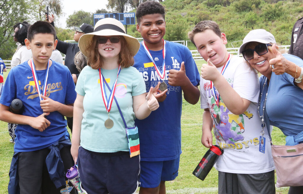 Young boys and girls with their participation medals. Students from Curtis School and Help Group Bridgeport School gathered for their second annual Unified Field Day
